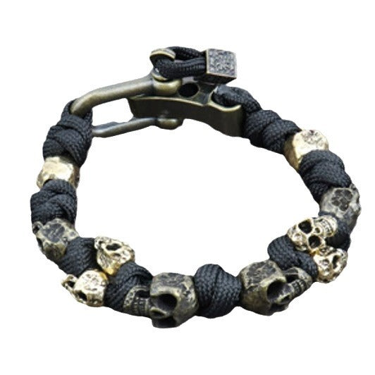 Bracelet with skull designs and a clasp on a white background