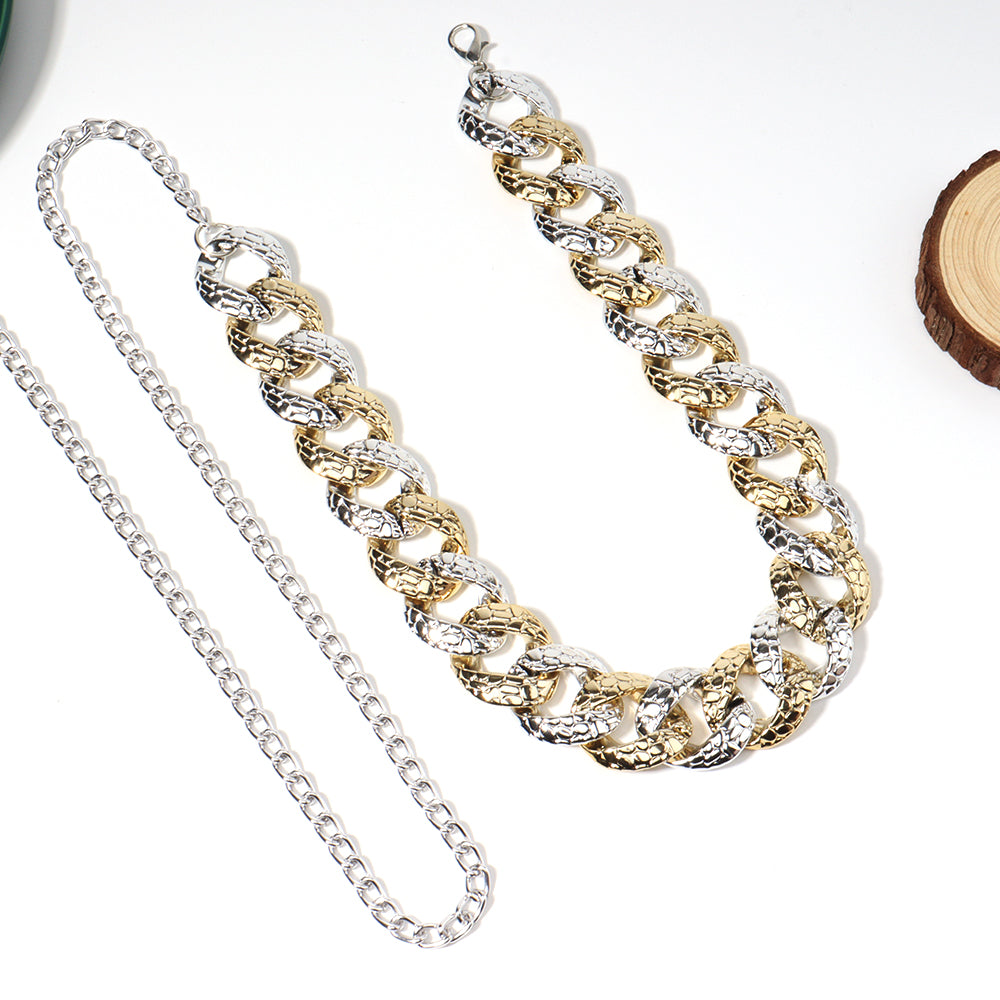 Two chain necklaces, one silver and one gold, on a white background.