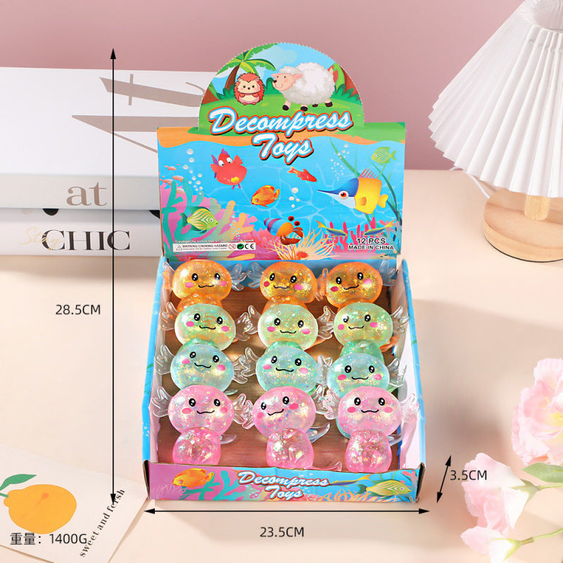 Packaged decompression squishy toys with colorful design on a light pink background