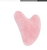 Pink heart-shaped object on a white background