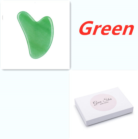 Green gua sha tool with 'Gua Sha' branding on a white background