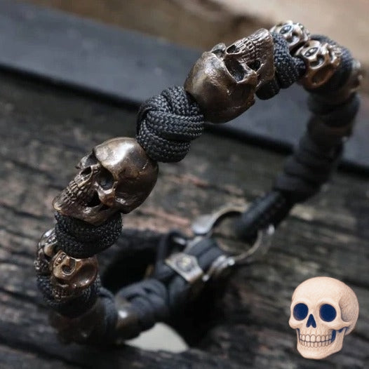 Bracelet with skull beads on a dark surface