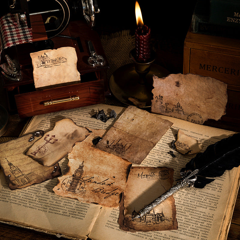 Vintage setting with old documents, a candle, and a book on a wooden table.