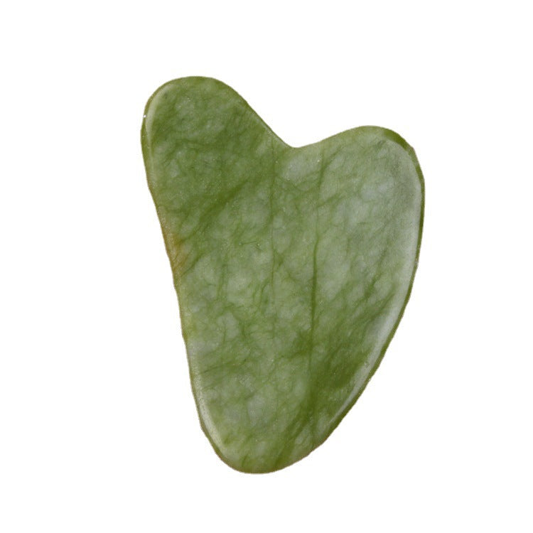 Green stone with a heart-shaped design on a white background