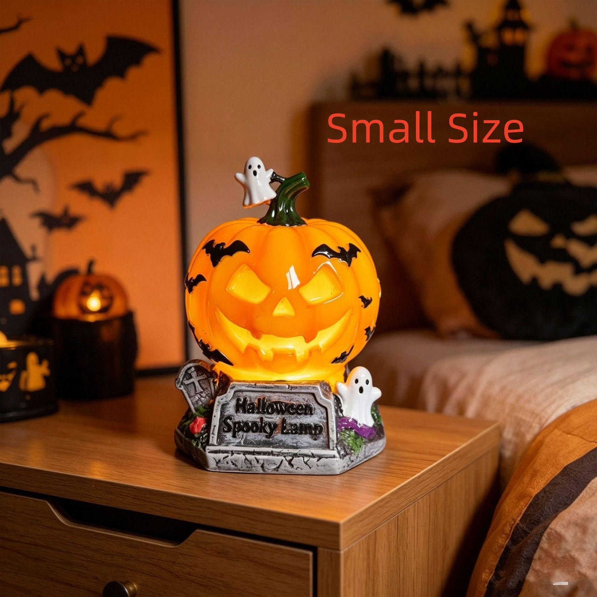 A small Halloween-themed decorative lamp shaped like a glowing jack-o'-lantern on a tombstone base, placed on a wooden bedside table in a bedroom. The scene includes a bed, wall decorations, and the text 'Small Size' in red.