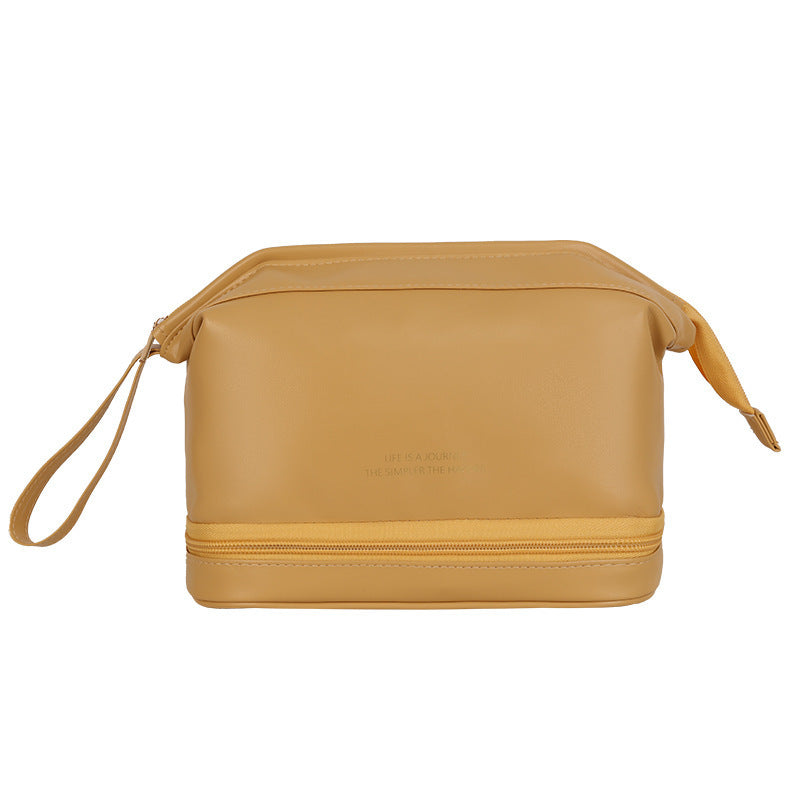 Yellow toiletry bag with a strap on a white background