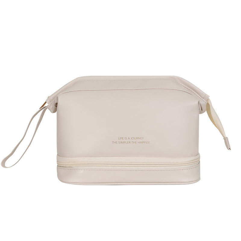 Beige travel bag with 'Life is a Journey' text on a white background