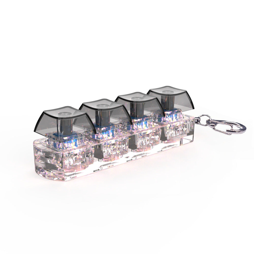 Clear keychain with four transparent containers and a metal clip on a white background