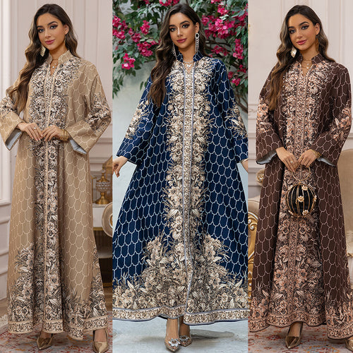 Three women wearing patterned dresses in different colors with a decorative background.