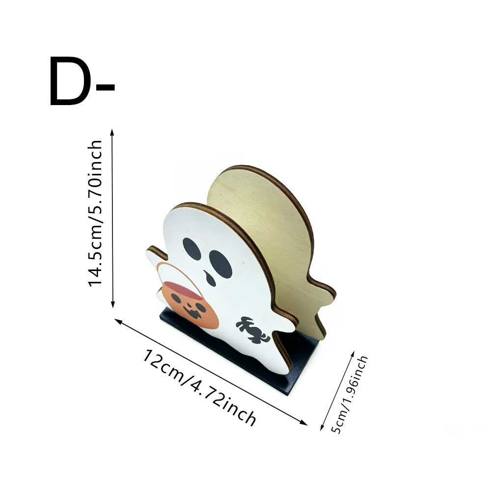 A ghost-shaped wooden stand with a white face, black eyes and mouth, and a light natural wood back, shown with dimension lines indicating 14.5 cm height, 12 cm width, and 5 cm depth on a white background.