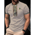 Man wearing a beige short-sleeve shirt with intricate patterns on a dark background