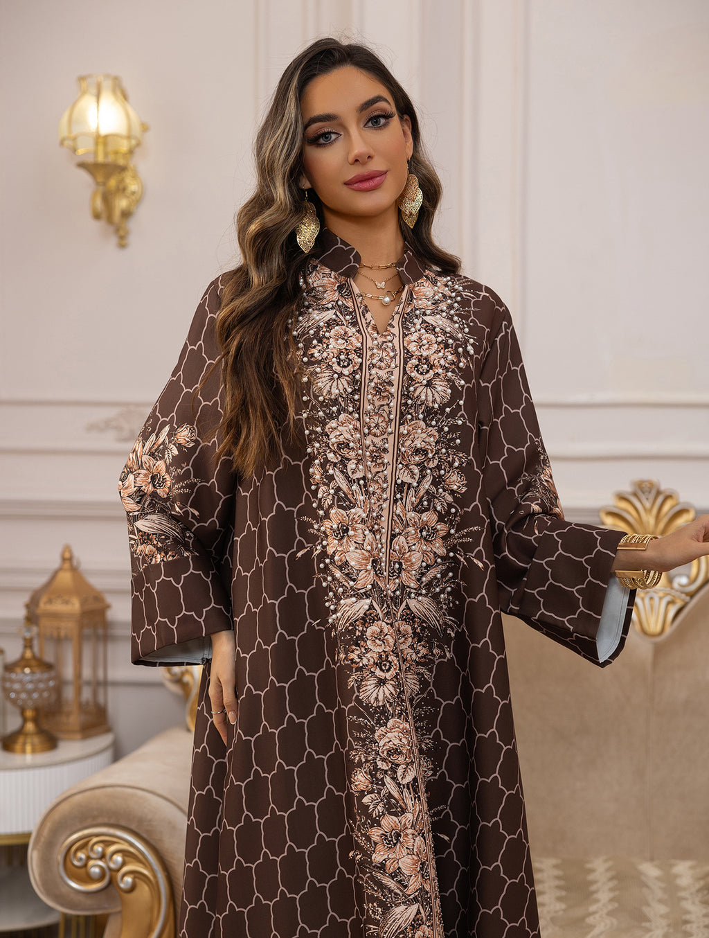 Woman wearing a patterned dress in an elegant interior setting