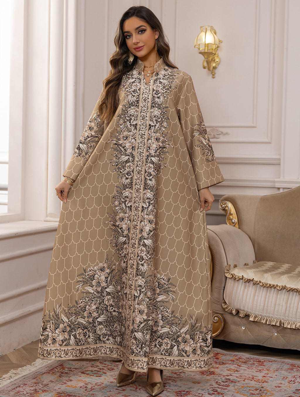 Woman wearing a beige embroidered dress in an elegant room.