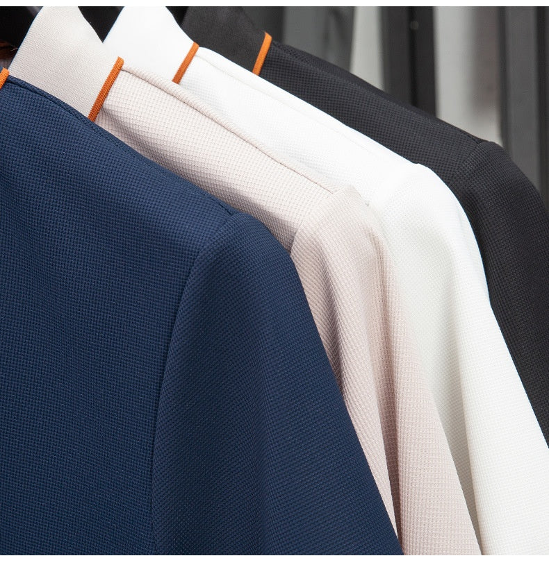 Close-up of navy, beige, and black textured fabric samples.