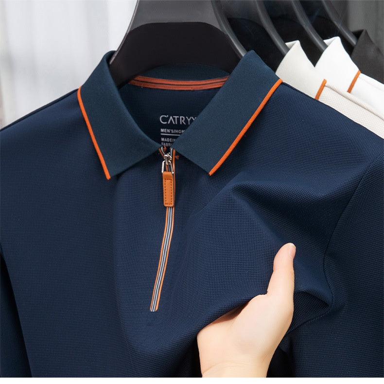 Navy polo shirt with orange accents and a zipper held by a hand, brand 'Catry' visible.