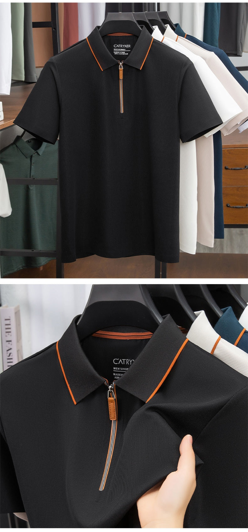 Black polo shirt with orange accents on a rack and held by a hand.